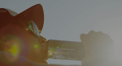 Man drinking from aluminum can