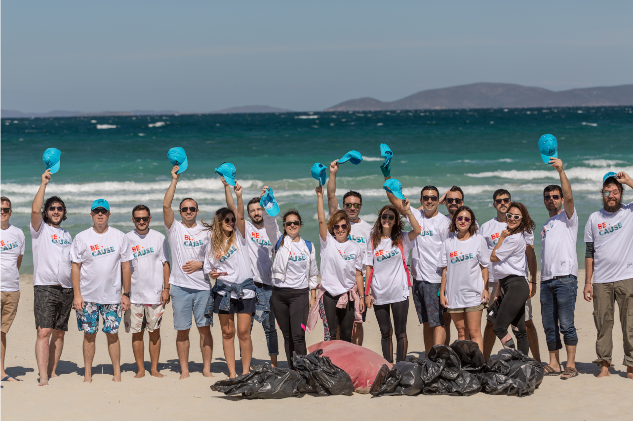 Volunteers standing together on a beach