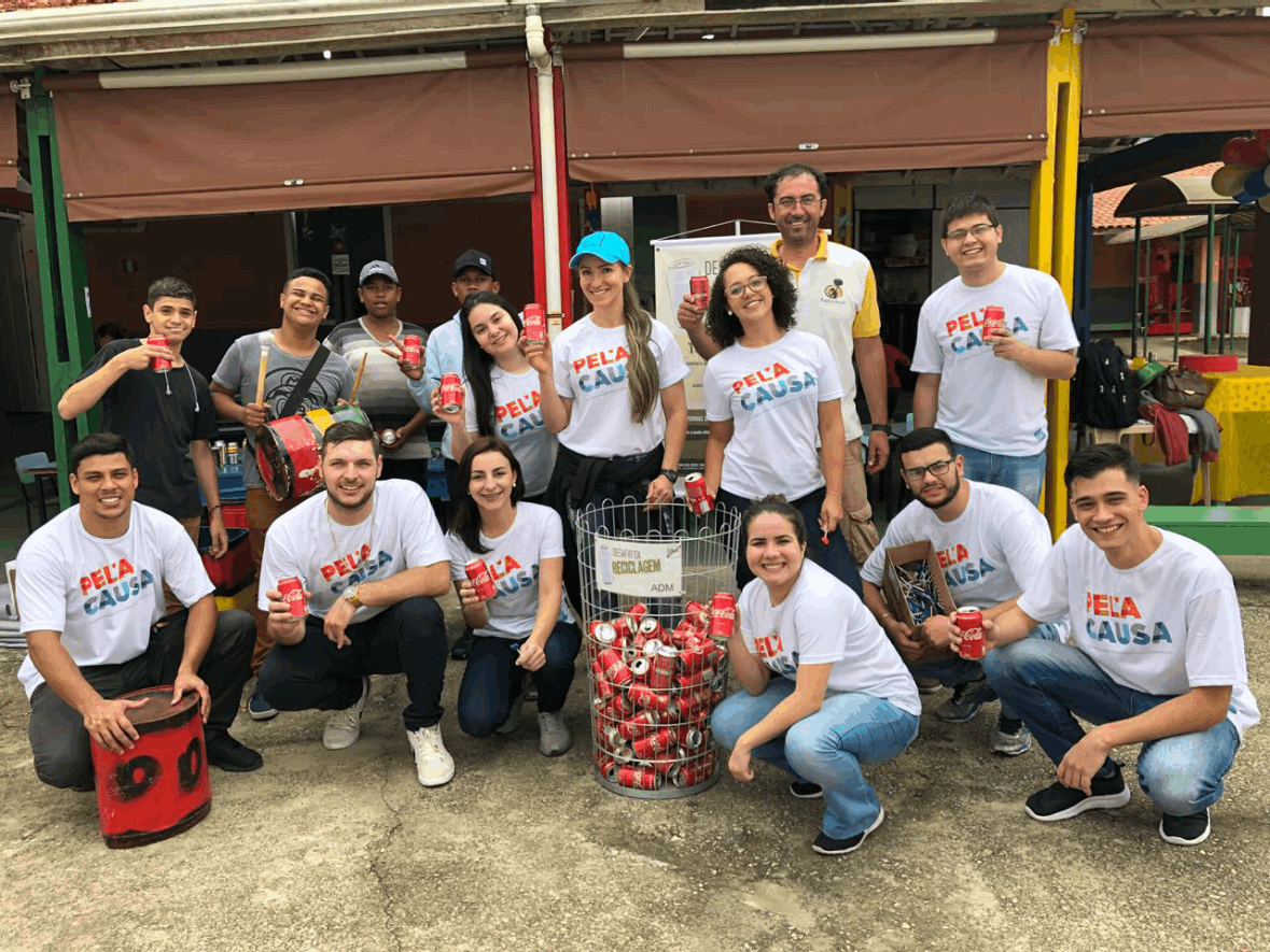 Employee volunteers pose together at an event